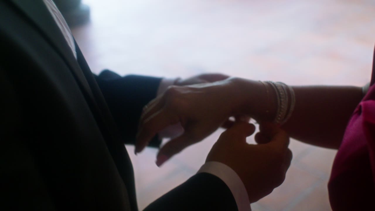 Fastening a bracelet before the ceremony